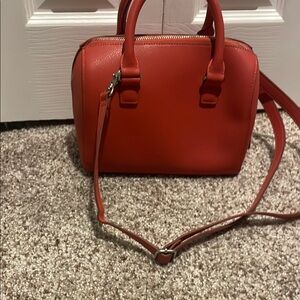 Red Crossbody Bag with Adjustable Strap and Structured Shape